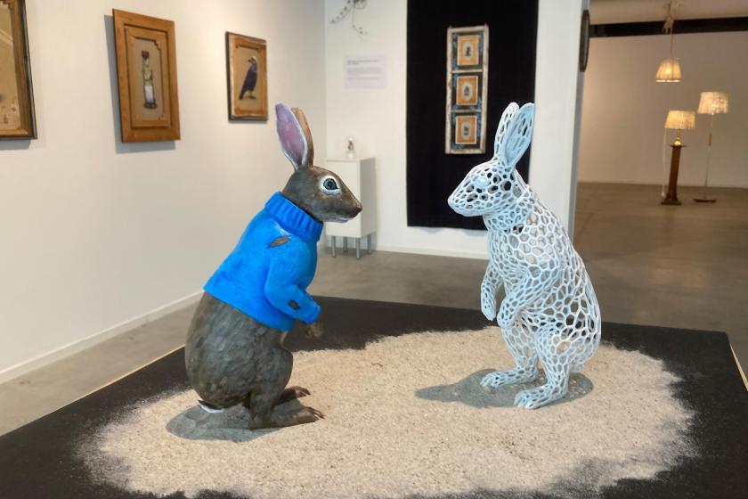 Two rabbits facing one another